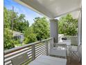 Relaxing front porch with white metal furniture and a grill at 261 Fletcher Sw St, Atlanta, GA 30315