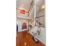 Grand foyer featuring hardwood floors, staircase, and modern decor creating an elegant entry at 4086 Haverhill Dr, Atlanta, GA 30342