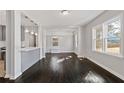 Bright dining area with dark hardwood floors and built-in bench at 1664 Columbia Dr, Decatur, GA 30032