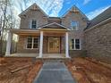 Brick house with a large front porch and white columns at 7449 Waterview Cv, Douglasville, GA 30135