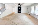 Spacious living room featuring a modern fireplace, white walls and a large picture window at 1275 Pj East Rd, Covington, GA 30014