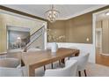 Bright dining room with a large wooden table and chandelier at 1215 Wynridge Xing, Alpharetta, GA 30005