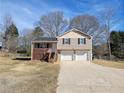 Tan house with 2 car garage and a large yard at 2043 Laird Rd, Hiram, GA 30141