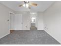 Spacious bedroom with ceiling fan and gray carpeting at 2657 Lenox Ne Rd # 79, Atlanta, GA 30324