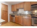 Well-equipped kitchen with wood cabinets and granite countertops at 2657 Lenox Ne Rd # 79, Atlanta, GA 30324