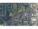 Aerial view of a vacant lot near residential homes at 261 Mount Vernon Nw Hwy, Atlanta, GA 30328