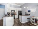 Bright kitchen with stainless steel appliances and a breakfast bar area at 401 16Th Nw St # 1179, Atlanta, GA 30363
