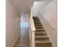 Bright and airy entryway with stairs leading to the second floor at 4222 High Park Ln, Atlanta, GA 30344