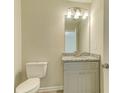 Charming half bathroom with granite countertop and neutral color palette at 3406 Mount Zion Rd, Stockbridge, GA 30281