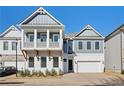 Two-story home with gray siding, white trim, and a two-car garage at 89 Batten Board Way, Woodstock, GA 30189