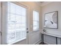 Bright entryway with white door, window blinds, and a small console table at 236 Hickory Commons Way, Canton, GA 30115