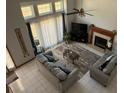 Spacious living room with high ceilings, fireplace, and lots of natural light at 4053 Chapel Mill Bnd, Decatur, GA 30034