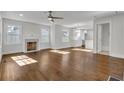 Spacious living room with hardwood floors, fireplace and open concept layout at 1271 Lorenzo Sw Dr, Atlanta, GA 30310