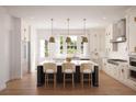 Spacious kitchen with island, modern cabinetry, and stainless steel appliances at 225 Mayfair Ct, Alpharetta, GA 30009