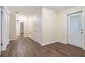 Bright hallway with wood-look flooring and access to other rooms at 2876 Battle Forrest Dr, Decatur, GA 30034