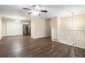 Open living room with wood-look floors and a view of the kitchen and staircase at 2876 Battle Forrest Dr, Decatur, GA 30034