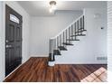 Modern entryway with dark hardwood floors and a black door at 3612 Springside Dr, Decatur, GA 30032