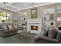 Cozy living room with fireplace, built-in shelving and lots of natural light at 1800 Clairmont Lk # 413, Decatur, GA 30033