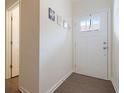 Bright entryway with hardwood floors and interior door at 413 Delancy Dr, Woodstock, GA 30189