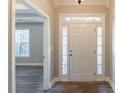 Bright entryway with hardwood floors and a view into the living room at 551 Garden View Ct, Lawrenceville, GA 30046