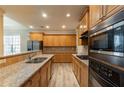 Spacious kitchen with granite countertops and modern appliances at 551 Garden View Ct, Lawrenceville, GA 30046