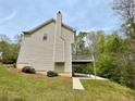 Two story home with a deck and wooded backyard at 1240 Falls Creek Ct, Conyers, GA 30094