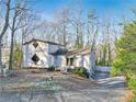 A unique two-story house nestled in a wooded area at 2046 Kinridge Ct, Marietta, GA 30062