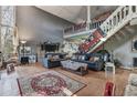 Spacious living room featuring high ceilings, a stone fireplace, and loft area at 2046 Kinridge Ct, Marietta, GA 30062