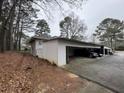 Carport with multiple parking spaces and wooded area at 4411 Idlewood Ln, Tucker, GA 30084