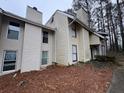 Townhouse for sale, featuring tan siding and windows at 4411 Idlewood Ln, Tucker, GA 30084