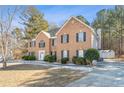 Two-story house with attached garage and manicured lawn at 643 Rangeley Meadows Ct, Hampton, GA 30228