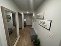 Bright and spacious entryway with a bench, mirror, and wood flooring at 221 Overlook Rd, Covington, GA 30014