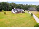 Farmhouse with long driveway and large grassy yard at 350 Taylor Path, Dallas, GA 30157