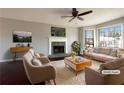 Virtually staged living room with fireplace, hardwood floors, and large windows at 225 Winchester Dr, Villa Rica, GA 30180