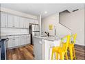 Modern kitchen with gray cabinets, granite countertops, and stainless steel appliances at 2570 Bayrose Cir, Atlanta, GA 30344