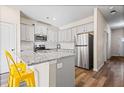 Modern kitchen featuring gray cabinets, granite countertops, and stainless steel appliances at 2570 Bayrose Cir, Atlanta, GA 30344