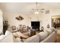 Spacious living room with comfortable seating and a fireplace at 303 Breezy Hill Walk, Stockbridge, GA 30281