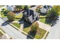Beautiful home with mature trees and a well-manicured lawn at 4851 Planters Walk, Douglasville, GA 30135