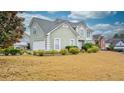 Two-story house with a side view showcasing a boat, landscaping, and a two-car garage at 729 River Bridge Dr, Lawrenceville, GA 30046