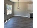 Bright dining room with chandelier and grey flooring at 111 Cassville-White, Cartersville, GA 30121