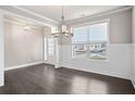 Formal dining room with hardwood floors and wainscoting at 3737 Lockaby Way, Lawrenceville, GA 30044