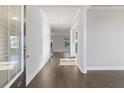 Bright entryway with hardwood floors and views into the living room at 3807 Lockaby Way, Lawrenceville, GA 30044