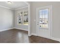 Home office with hardwood floors and a window overlooking the yard at 3807 Lockaby Way, Lawrenceville, GA 30044