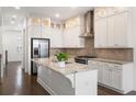 Modern kitchen with white cabinets, granite counters, and stainless steel appliances at 4223 Deming Cir, Atlanta, GA 30342