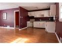 Simple kitchen with white cabinets and laminate flooring at 785 Jett Rd, Jonesboro, GA 30236