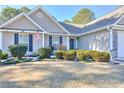 House exterior with American flag and manicured bushes at 340 Annslee Cir, Loganville, GA 30052