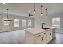 Modern kitchen island with white cabinets and stainless steel appliances at 754 Trevett Way, Marietta, GA 30062