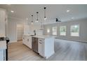 Open concept kitchen, white cabinets, island with quartz countertops at 754 Trevett Way, Marietta, GA 30062