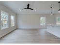 Spacious living area with wood-look flooring and large windows at 754 Trevett Way, Marietta, GA 30062