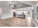 Open living room with vaulted ceiling and kitchen island at 8870 Callaway Dr, Winston, GA 30187